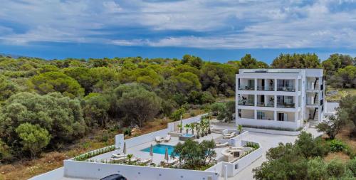 an aerial view of a white building with a pool at Luxury Villa Del Sogno with pool, jacuzzi, parking in Trogir