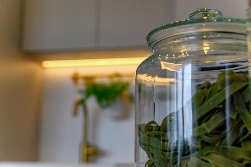 a glass jar with a green plant in it at Luxury Villa Del Sogno with pool, jacuzzi, parking in Trogir