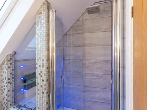 a shower with a glass door in a bathroom at Pass the Keys Gorgeous Central House in Bournemouth