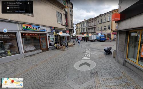 an empty street in a city with buildings at Apartament Alibi in Przemyśl