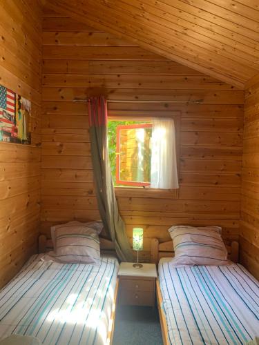 Postel nebo postele na pokoji v ubytování Chalet 16 pâquerette