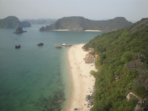 an aerial view of a beach with boats in the water at Phuong Mai Family Hotel in Cat Ba