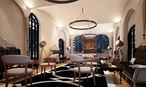 a living room filled with furniture and a chandelier at Venetiean Condo Pattaya by LJB719 in Jomtien Beach