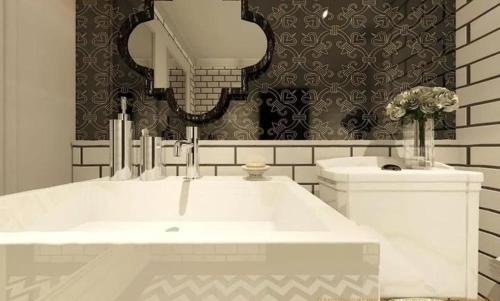 a bathroom with a white sink and a mirror at Venetiean Condo Pattaya by LJB719 in Jomtien Beach