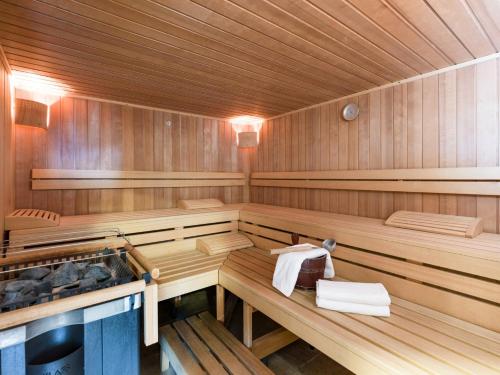 a sauna with wooden paneled walls at Appartment Thumerhof Wildschönau in Niederau