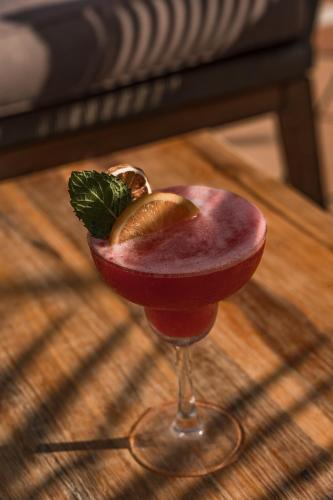 a drink in a wine glass on a table at Cooks Club Calvia Beach - Adults Only in Magaluf