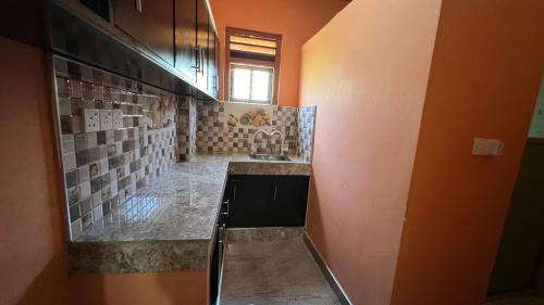 a kitchen with a sink and a counter top at Ramya’s Villa in Trincomalee