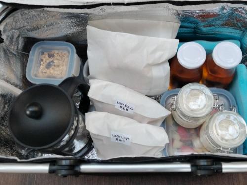 a suitcase filled with food and other items at Lazy Days B&B in Broadstairs