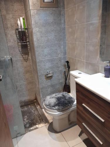 a bathroom with a shower and a toilet and a sink at المغرب القنيطره in Kenitra