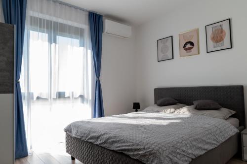 Cama o camas de una habitación en Apartamentul Ștefan Băile Felix