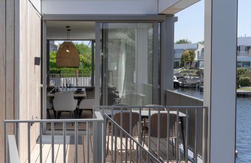 a view from the balcony of a house with a table and chairs at Villa Nautica Kortgene in Kortgene
