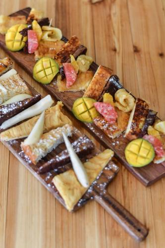 a group of different types of food on a wooden table at Novotel Paris Créteil Le Lac in Créteil