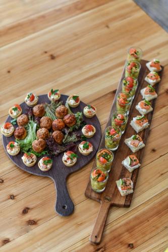 a tray of mini appetizers on a wooden table at Novotel Paris Créteil Le Lac in Créteil