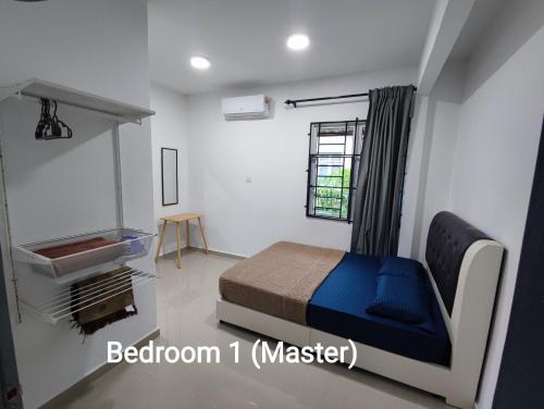 a bedroom with a bed and a sink in a room at 4A Home2Stay in Kota Bharu