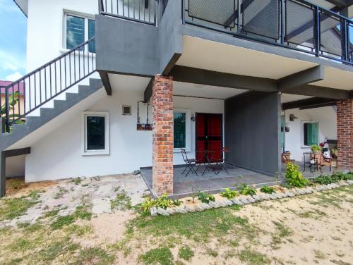 a house with a staircase and a patio at 4A Home2Stay in Kota Bharu