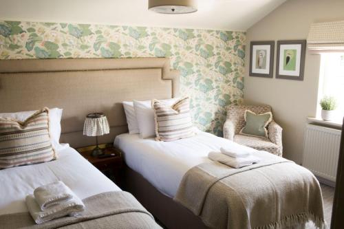Ein Bett oder Betten in einem Zimmer der Unterkunft Alvanley Arms, Cotebrook