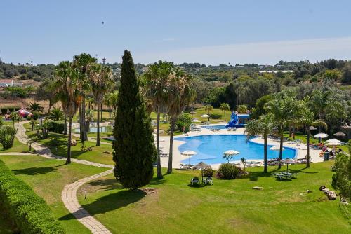 an overhead view of a pool at a resort at The Navigator - Palm Oasis Alvor - All Inclusive in Alvor