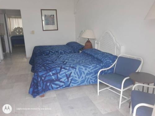 Ένα ή περισσότερα κρεβάτια σε δωμάτιο στο Departamento junto a Las Hadas Manzanillo