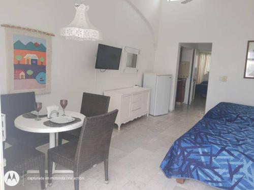 Ένα ή περισσότερα κρεβάτια σε δωμάτιο στο Departamento junto a Las Hadas Manzanillo