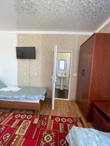 Guest House Ugraにあるベッド