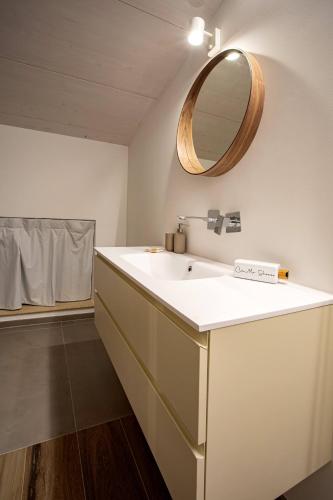 a bathroom with a white sink and a mirror at Car.Ma - comfy rooms in Porto SantʼElpidio