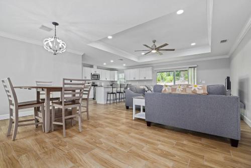 a kitchen and living room with a table and chairs at The Quiet Oasis in Weeki Wachee