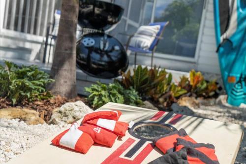 a pair of red gloves sitting on a table at Catch the Breeze on Crystal Beach in Palm Harbor