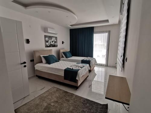 Postel nebo postele na pokoji v ubytování alternatif villaları 3