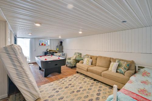a living room with a couch and a pool table at Weymouth Waterfront Getaway with Swim Spa and Hot Tub in Weymouth