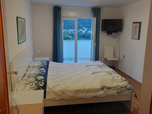 Katil atau katil-katil dalam bilik di Apartmani Mujagic