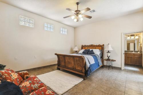 a bedroom with a bed and a ceiling fan at Las Cruces Vacation Rental Near Trails and Golf! in Las Cruces