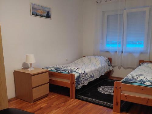 Katil atau katil-katil dalam bilik di Apartmani Mujagic