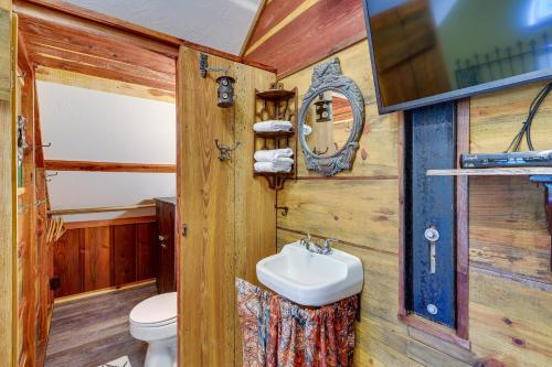 a bathroom with a toilet and a sink at Pet-Friendly Eureka Springs Rental with Private Deck in Eureka Springs