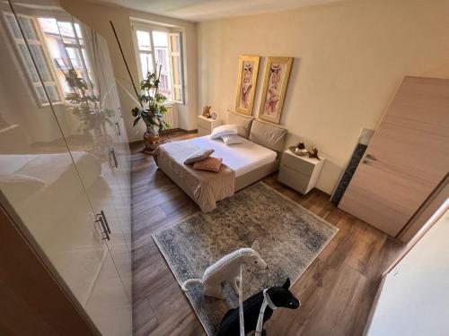 a small bedroom with a bed and a shower at Casa San Marco in Pisogne