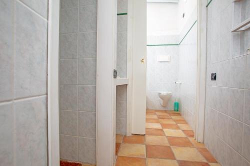 a bathroom with a shower and a toilet at Residence La Marmorata in Santa Teresa Gallura