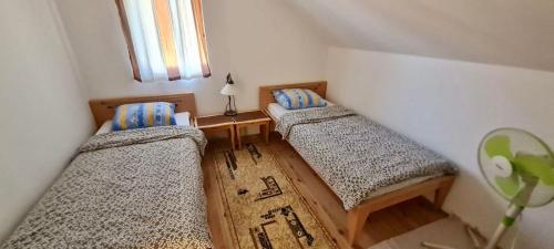 Postel nebo postele na pokoji v ubytování Apartman Muratagic