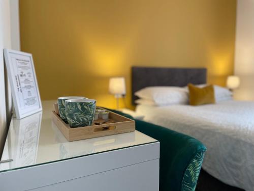 a bedroom with a bed and a night stand with a drawer at The seahorse in Blythe