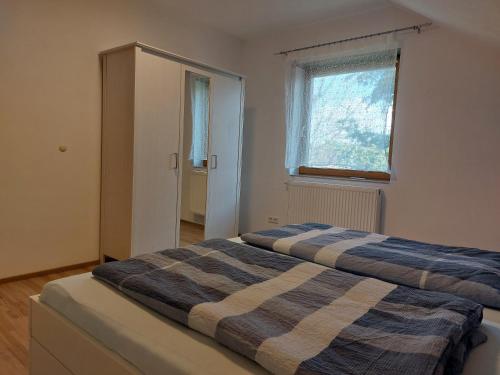 Postel nebo postele na pokoji v ubytování Alpensonne