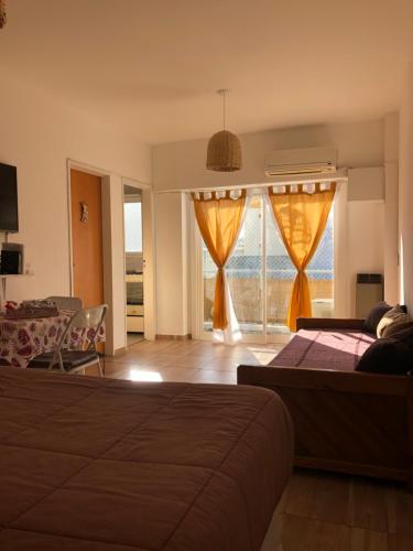 a bedroom with a bed and a view of the ocean at Departamento En Flores Av Avellaneda, Nazca Excelente Ubicación En Centro Comercial in Buenos Aires
