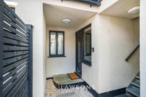 a entrance to a house with a black gate at Cosy Living by Lawsons in Windsor