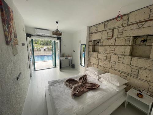 Postel nebo postele na pokoji v ubytování ALAÇATI XL LUXURY HOTEL