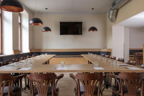 a large conference room with tables and chairs at Pivovar Rožmberk in Rožmberk nad Vltavou