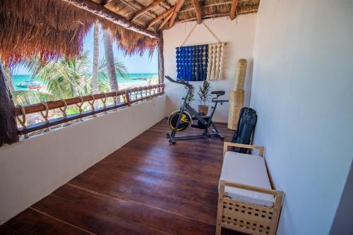 a room with a view of the ocean at Amaite Holbox - Oceanfront Hotel in Holbox Island