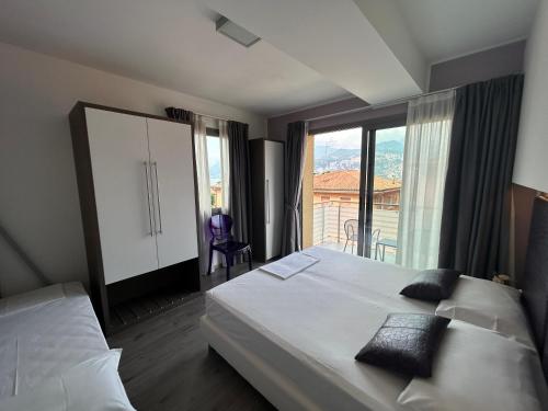 Ένα ή περισσότερα κρεβάτια σε δωμάτιο στο Gardesana Active Apartments