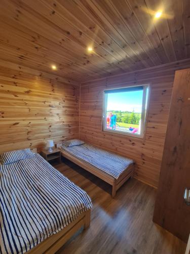 Postel nebo postele na pokoji v ubytování Domki Róża Bobolin