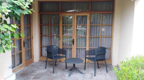 a group of chairs and a table on a patio at Hotel y Departamentos La Serena - Caja Los Andes in La Serena