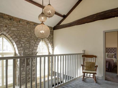 a room with a staircase with a stone wall at Old Chapel House in Barnoldswick