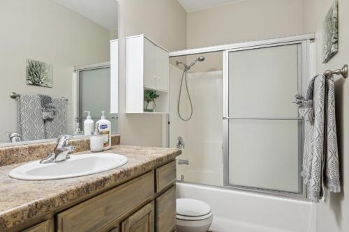 a bathroom with a sink and a shower at Welcoming Mesquite Condo with Pool Access! in Mesquite