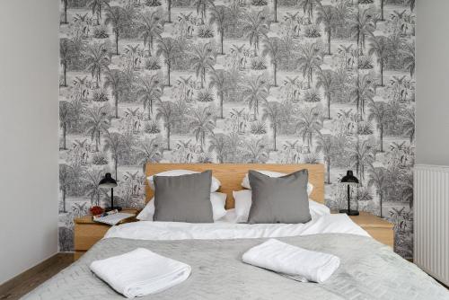 Posteľ alebo postele v izbe v ubytovaní Siedmiogrodzka P&O Serviced Apartments
