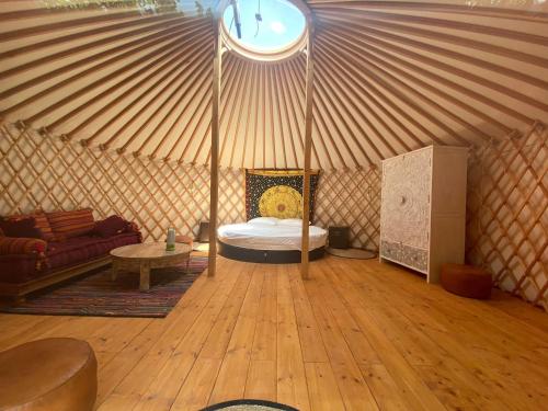 a room with a bed in a yurt at TENUTA IL GUERRIERO in Capestrano